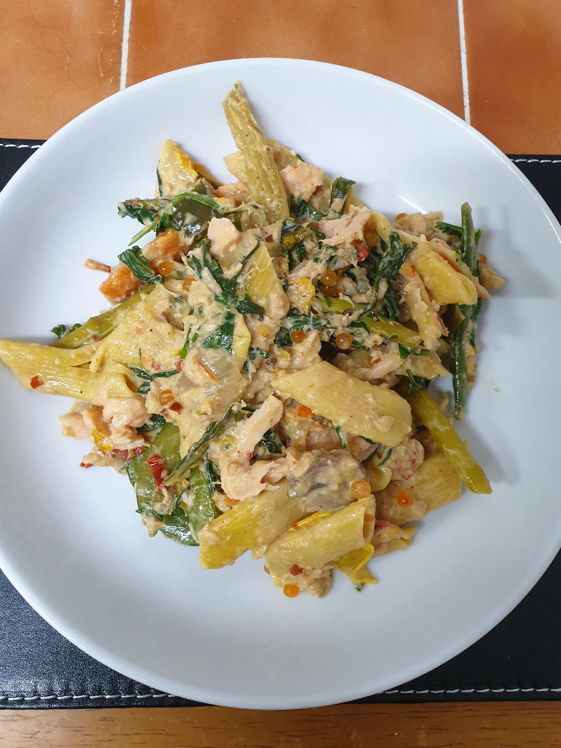 Fresh egg penne with cream, asparagus, mushrooms, kale, smoked salmon, crayfish, whitefish, and rainbow trout caviar
