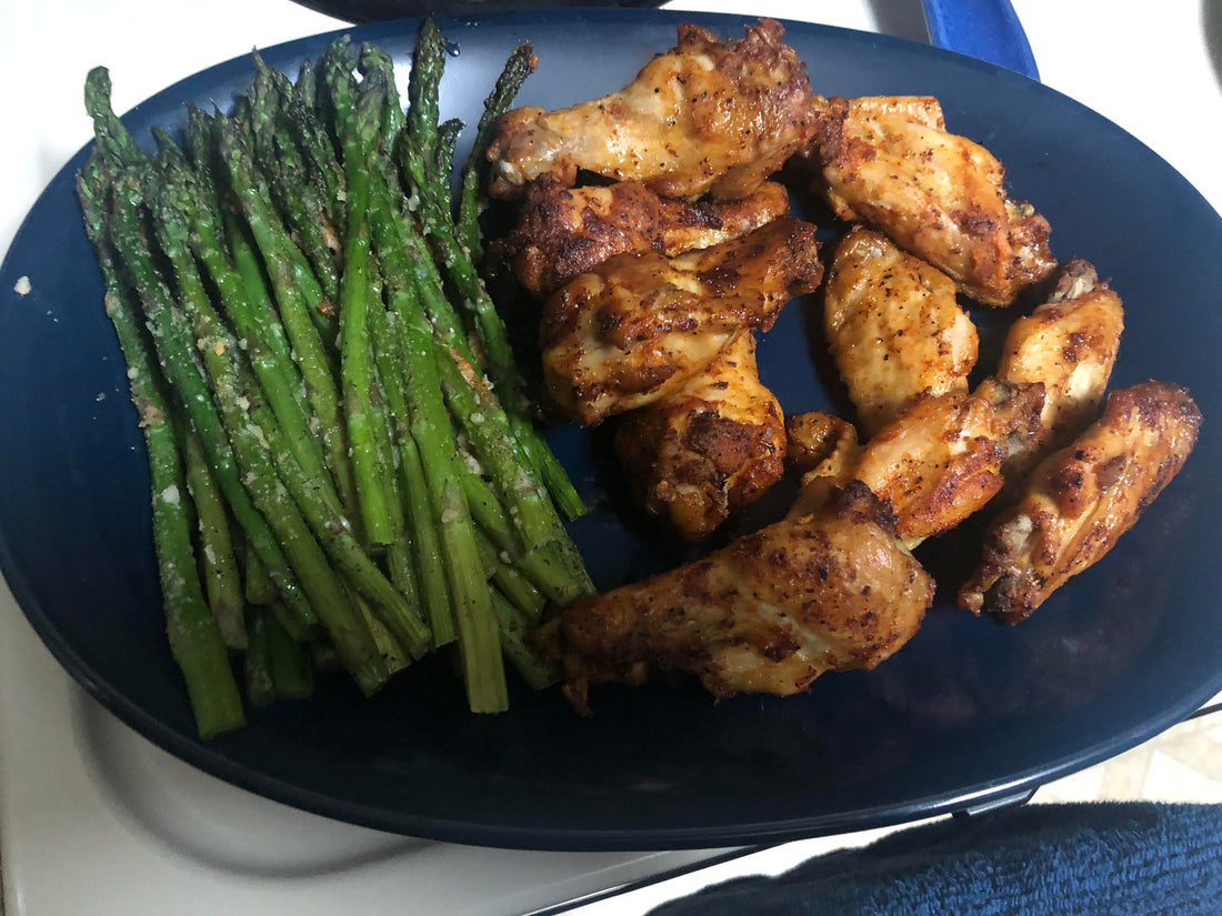 Baked bbq wings (sauce on the side) with roasted parmesan asparagus