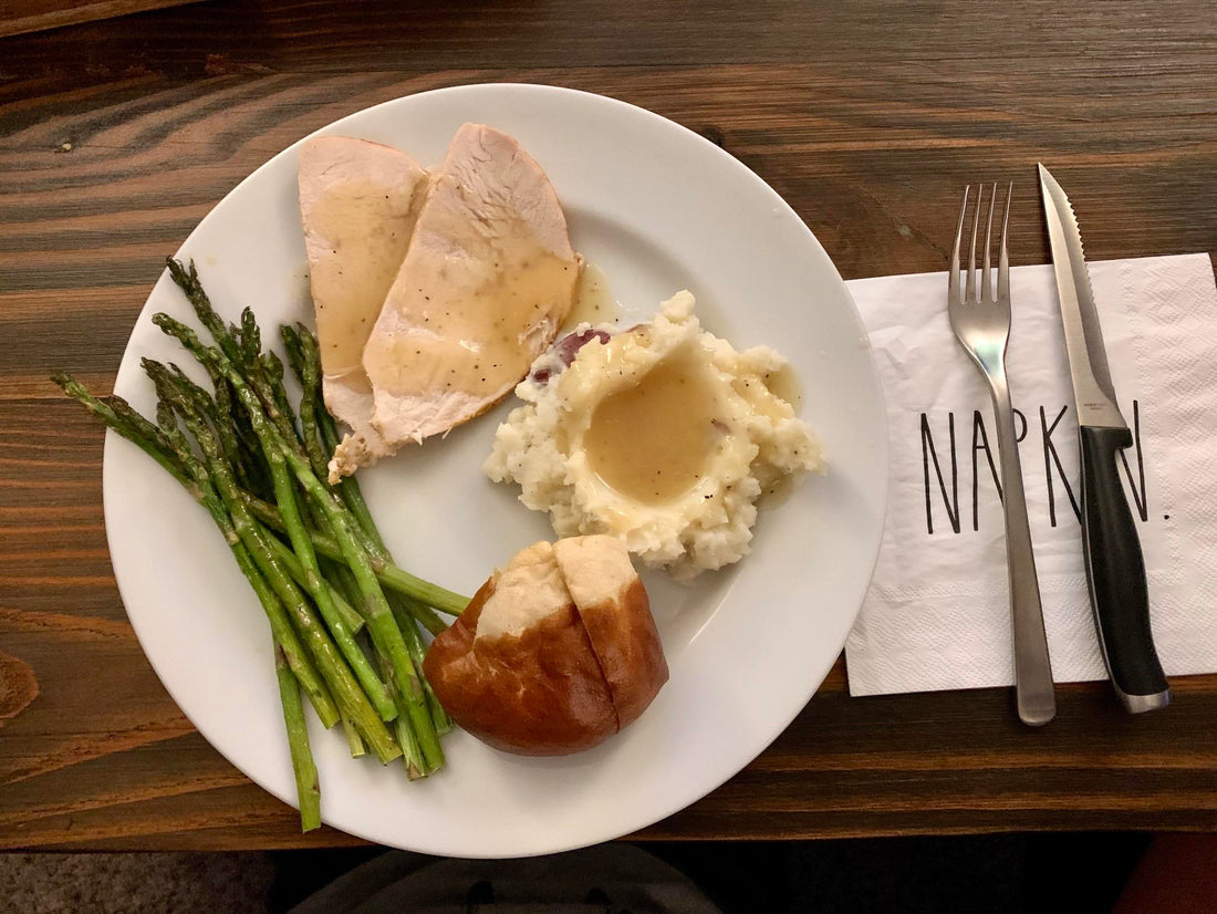 Thankful for delicious food and a wonderful life during this weird time. Roasted turkey breast, homemade mashed red potatoes, gravy, seasoned asparagus and a warm, buttered pretzel roll.