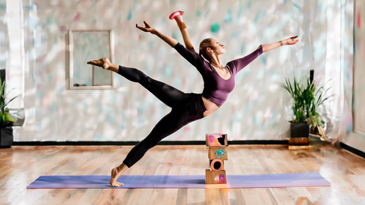 Sure, here is a DALL-E prompt for an image that relates to the article title Essential Functional Yoga Gear for Dancers:

**Prompt:**

A dancer wearing functional yoga gear, such as a yoga mat, yoga b